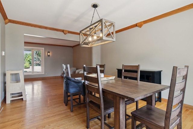 10215 S 87th Ct, Palos Hills, IL 60465 - dining room featuring a chandelier, crown molding, and light wood-style floors