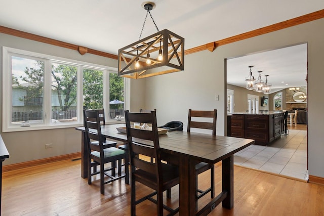 10215 S 87th Ct, Palos Hills, IL 60465 - dining space featuring a chandelier and light wood-type flooring