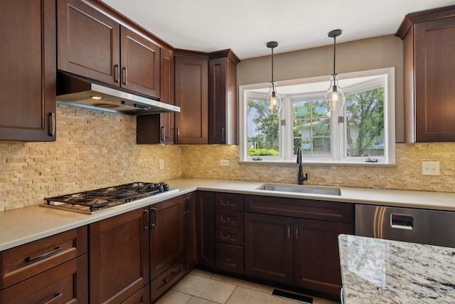 10215 S 87th Ct, Palos Hills, IL 60465 - kitchen with appliances with stainless steel finishes, under cabinet range hood, hanging light fixtures, backsplash, and dark brown cabinetry