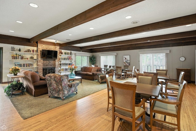 740 Saint Andrews Ln Unit 5, Crystal Lake, IL 60014 - dining room featuring light wood-style floors, recessed lighting, beamed ceiling, and a fireplace
