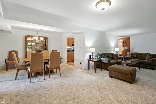 740 Saint Andrews Ln Unit 5, Crystal Lake, IL 60014 - living area with a chandelier and light colored carpet