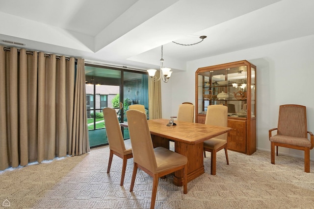 740 Saint Andrews Ln Unit 5, Crystal Lake, IL 60014 - dining room with light carpet and a chandelier
