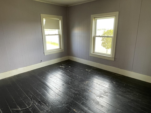6808 S Oak Grove Rd, Harvard, IL 60033 - empty room featuring wood-type flooring and wooden walls