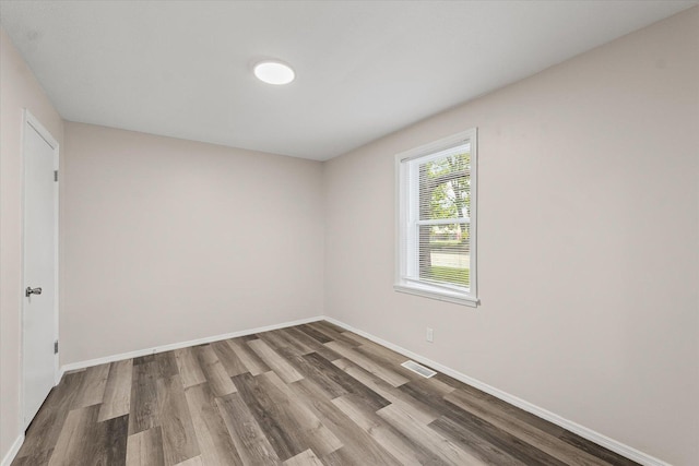1010 N Neil St, Champaign, IL 61820 - unfurnished room featuring wood finished floors
