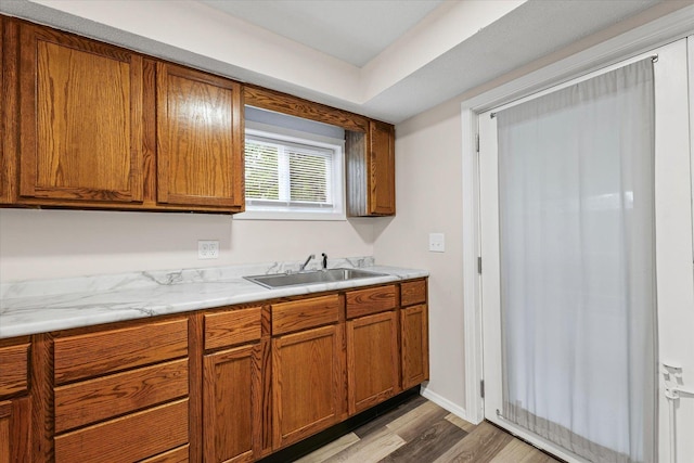 1010 N Neil St, Champaign, IL 61820 - kitchen featuring brown cabinets, dark wood-style floors, and light countertops