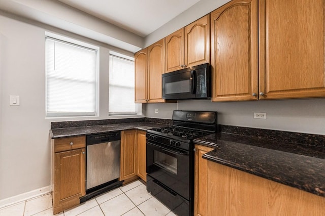 4008 W Nelson St Unit 8A, Chicago, IL 60641 - kitchen with black appliances, light tile patterned floors, dark stone counters, and brown cabinetry