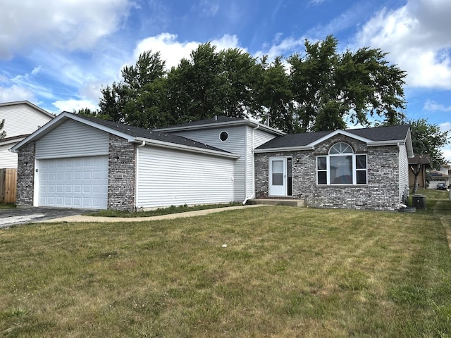 1244 Harvest Ln, University Park, IL 60484 - view of front of home featuring an attached garage, a front lawn, driveway, and brick siding