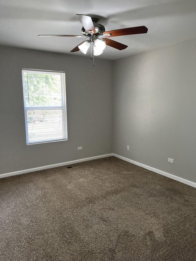 1244 Harvest Ln, University Park, IL 60484 - unfurnished room featuring a ceiling fan and dark colored carpet