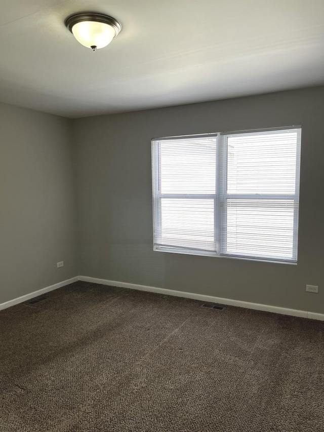 1244 Harvest Ln, University Park, IL 60484 - unfurnished room featuring baseboards and dark colored carpet