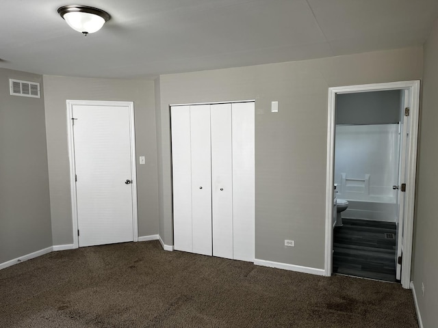 1244 Harvest Ln, University Park, IL 60484 - unfurnished bedroom featuring dark colored carpet, a closet, and connected bathroom