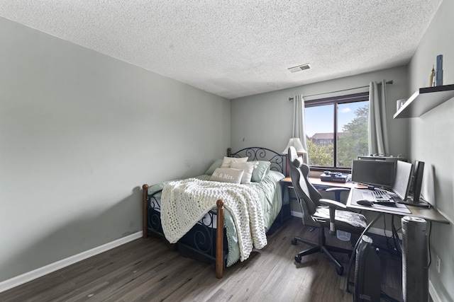 15141 Quail Hollow Dr Unit 106, Orland Park, IL 60462 - bedroom with wood finished floors, a textured ceiling, and an office area