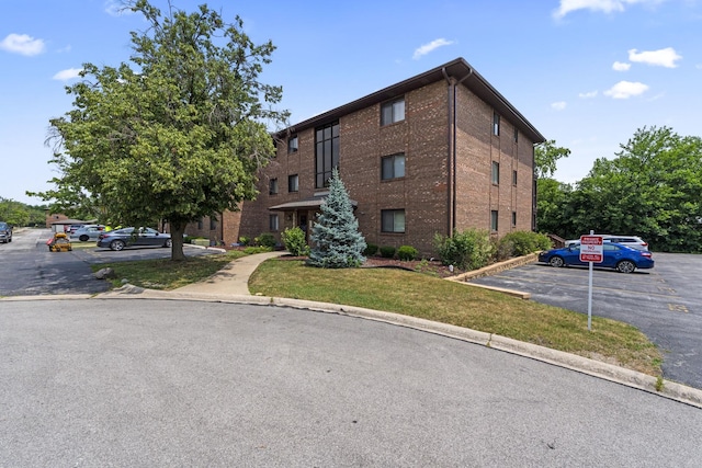 15141 Quail Hollow Dr Unit 106, Orland Park, IL 60462 - view of building exterior featuring uncovered parking