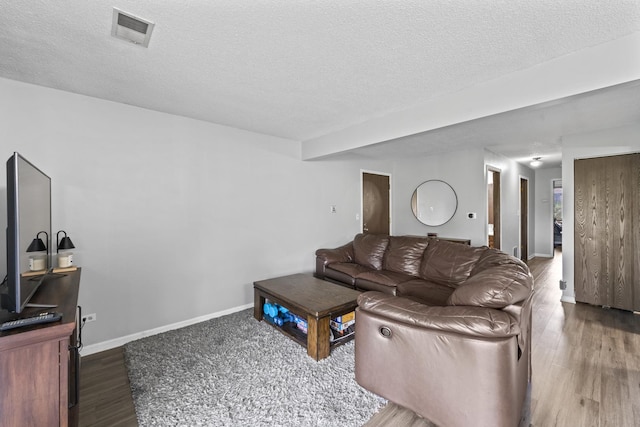 15141 Quail Hollow Dr Unit 106, Orland Park, IL 60462 - living room with a textured ceiling and wood finished floors