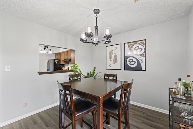 15141 Quail Hollow Dr Unit 106, Orland Park, IL 60462 - dining area with a chandelier, dark wood-style flooring, and a textured ceiling