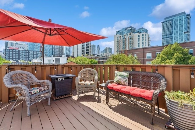 250 W Scott St Unit C, Chicago, IL 60610 - wooden deck featuring a skyline view and an outdoor hangout area