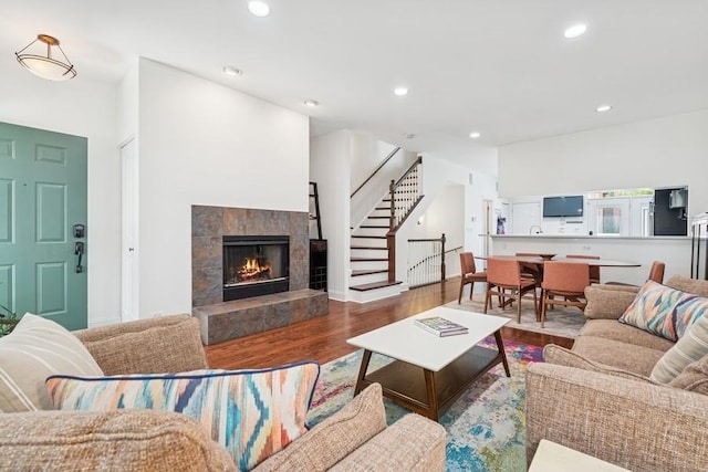 250 W Scott St Unit C, Chicago, IL 60610 - living room with stairway, wood finished floors, recessed lighting, and a tile fireplace