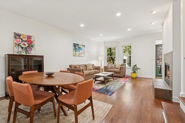 250 W Scott St Unit C, Chicago, IL 60610 - dining area with wood finished floors, a tiled fireplace, and recessed lighting