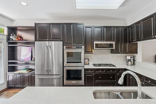 250 W Scott St Unit C, Chicago, IL 60610 - kitchen featuring appliances with stainless steel finishes, light countertops, wood finished floors, and recessed lighting