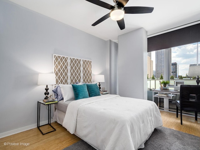 659 W Randolph St Unit 421, Chicago, IL 60661 - bedroom with light wood-style flooring and a ceiling fan
