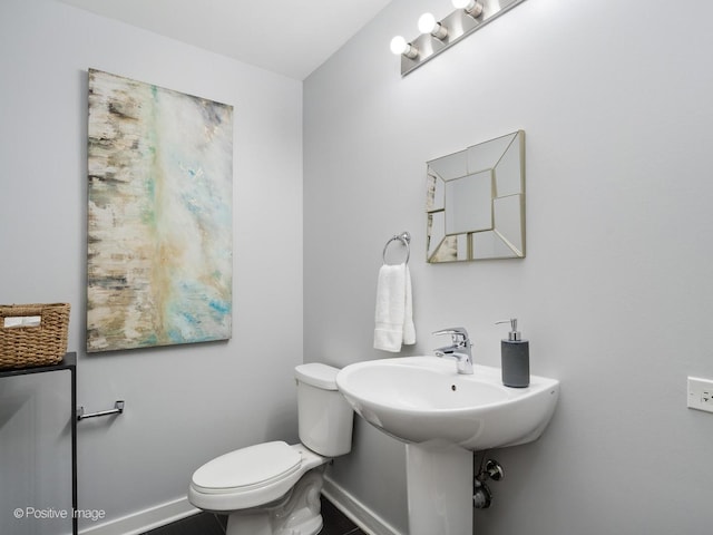659 W Randolph St Unit 421, Chicago, IL 60661 - half bathroom featuring baseboards and toilet