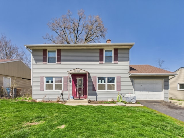 426 Norton Ave, Glendale Heights, IL 60139 - traditional home with a garage, asphalt driveway, and a chimney