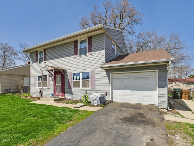 426 Norton Ave, Glendale Heights, IL 60139 - traditional-style house with an attached garage, driveway, and a front yard