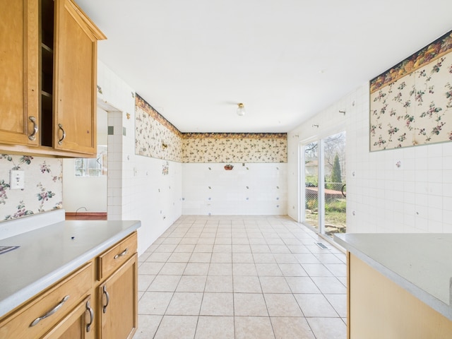 426 Norton Ave, Glendale Heights, IL 60139 - kitchen featuring tile walls, light tile patterned flooring, and light countertops