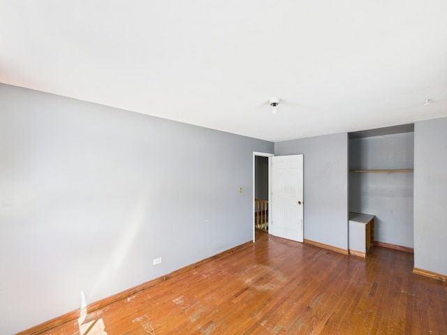426 Norton Ave, Glendale Heights, IL 60139 - unfurnished bedroom featuring wood finished floors and baseboards