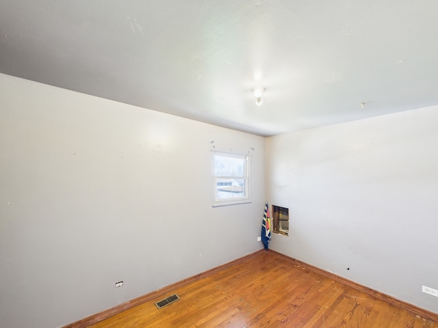 426 Norton Ave, Glendale Heights, IL 60139 - empty room featuring light wood-style flooring and heating unit
