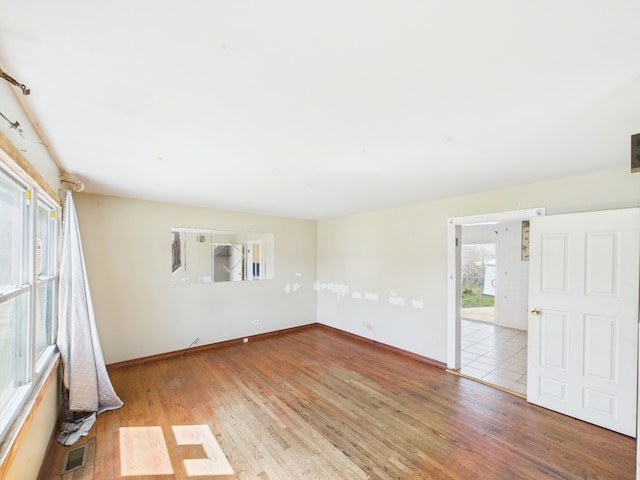 426 Norton Ave, Glendale Heights, IL 60139 - empty room with wood finished floors and baseboards