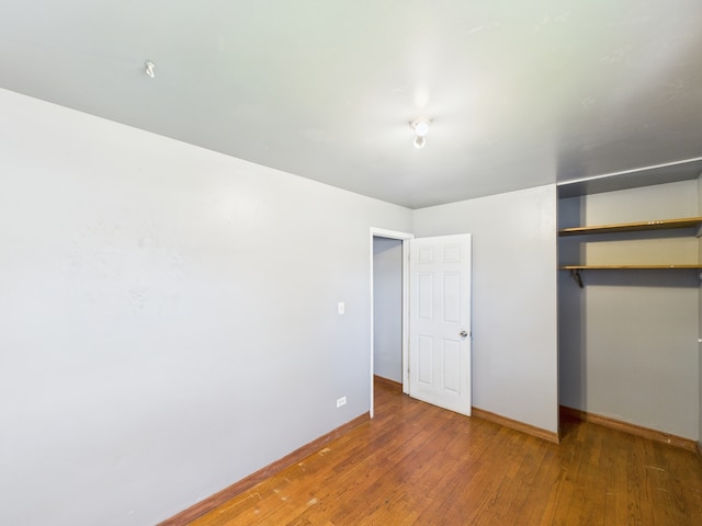 426 Norton Ave, Glendale Heights, IL 60139 - unfurnished bedroom with a closet and hardwood / wood-style floors