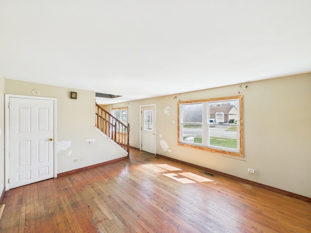 426 Norton Ave, Glendale Heights, IL 60139 - unfurnished living room featuring hardwood / wood-style floors and stairs