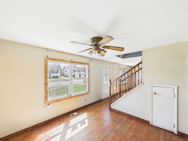 426 Norton Ave, Glendale Heights, IL 60139 - empty room with ceiling fan, wood-type flooring, and stairway