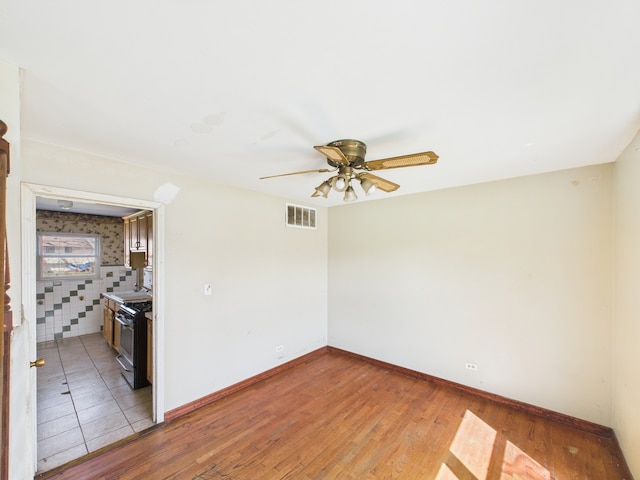 426 Norton Ave, Glendale Heights, IL 60139 - empty room featuring ceiling fan and light wood-type flooring