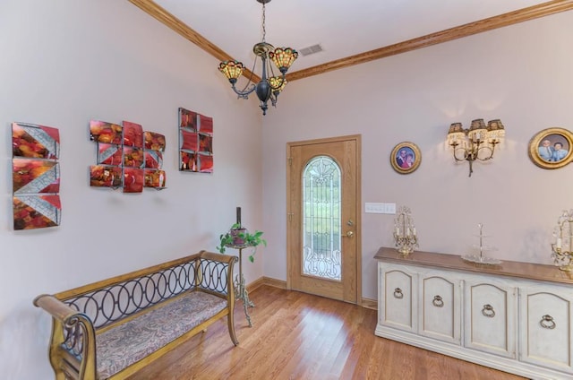 12571 W 3000 N Rd, Bonfield, IL 60913 - foyer with a chandelier, ornamental molding, and light wood-style floors