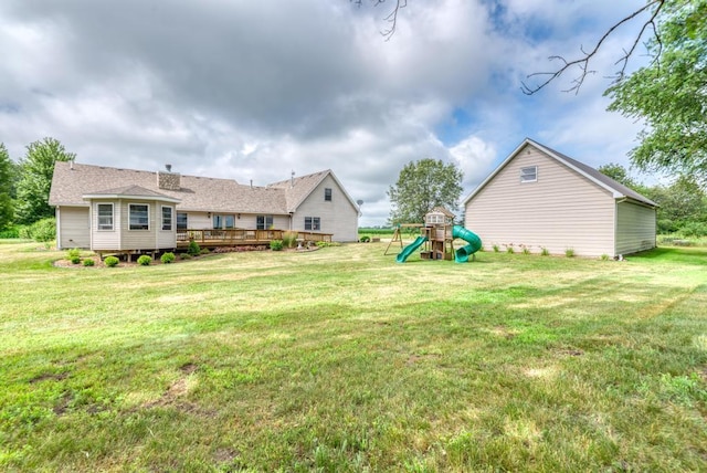 12571 W 3000 N Rd, Bonfield, IL 60913 - view of grassy yard featuring a playground and a wooden deck