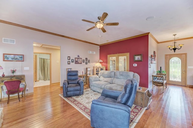 12571 W 3000 N Rd, Bonfield, IL 60913 - living area with attic access, light wood finished floors, a ceiling fan, crown molding, and french doors