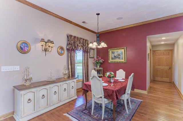 12571 W 3000 N Rd, Bonfield, IL 60913 - dining room with light wood-type flooring, a chandelier, and ornamental molding