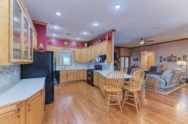 12571 W 3000 N Rd, Bonfield, IL 60913 - kitchen featuring black appliances, ornamental molding, ceiling fan, decorative backsplash, and light wood-style flooring