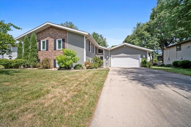 204 Collins Dr, Normal, IL 61761 - view of front facade featuring concrete driveway, a front yard, and an attached garage