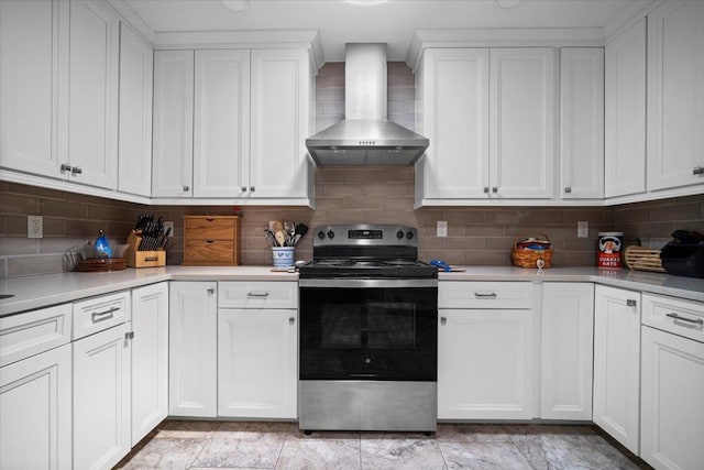 204 Collins Dr, Normal, IL 61761 - kitchen with stainless steel electric range oven, wall chimney range hood, light countertops, decorative backsplash, and white cabinets