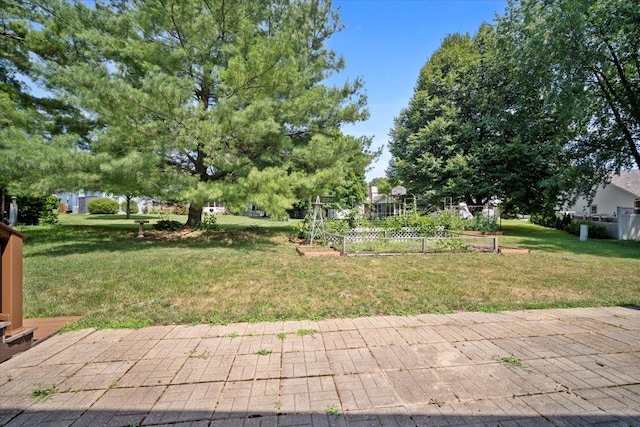 204 Collins Dr, Normal, IL 61761 - view of grassy yard featuring a vegetable garden