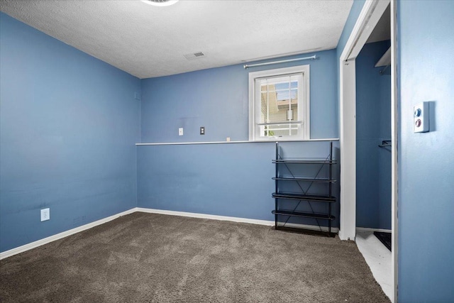 204 Collins Dr, Normal, IL 61761 - spare room featuring carpet flooring and a textured ceiling