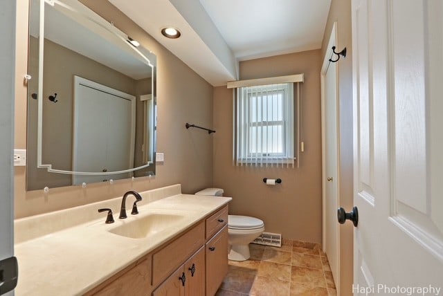 8308 W Leland Ave, Norridge, IL 60706 - bathroom featuring vanity and toilet