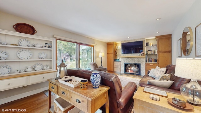 27W558 Ridgeview St, West Chicago, IL 60185 - living area featuring wood finished floors, a large fireplace, and built in features