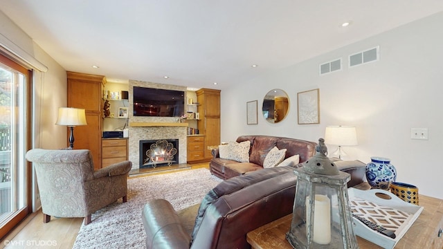 27W558 Ridgeview St, West Chicago, IL 60185 - living room with light wood finished floors, a fireplace, and recessed lighting