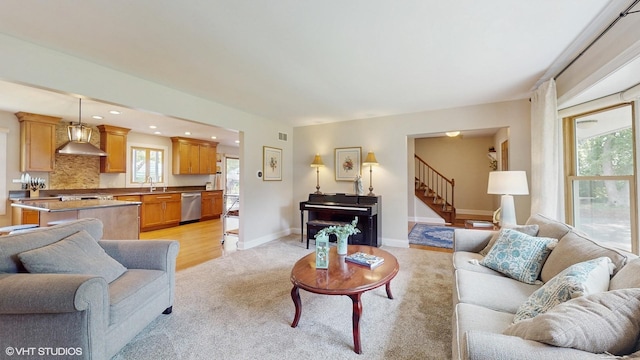 27W558 Ridgeview St, West Chicago, IL 60185 - living room featuring light carpet, plenty of natural light, stairway, and recessed lighting