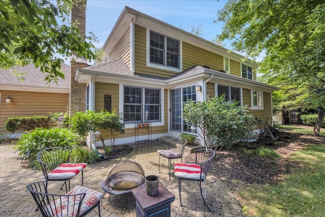 531 N Easy St, Palatine, IL 60067 - rear view of property with an outdoor fire pit and a patio