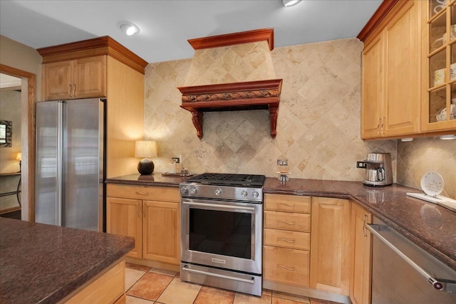 531 N Easy St, Palatine, IL 60067 - kitchen featuring appliances with stainless steel finishes, backsplash, glass insert cabinets, dark stone counters, and light tile patterned floors