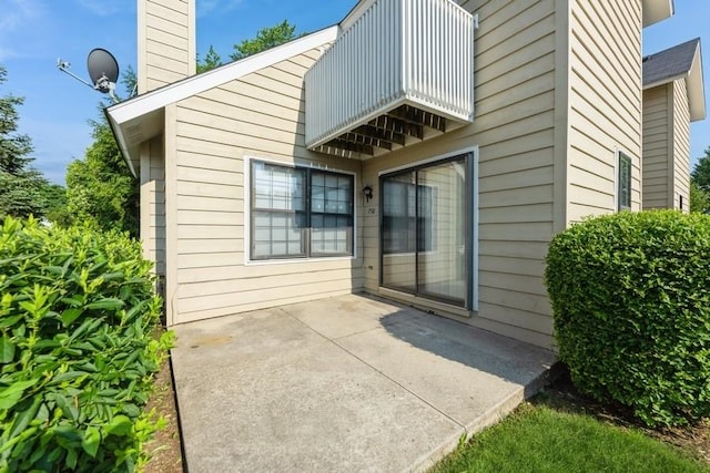 758 Sizer Rd, Gurnee, IL 60031 - rear view of property featuring a chimney, a patio, and a balcony